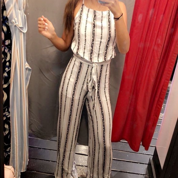 White Jumpsuit with brown and black stripes/accents. Open Back with Tie - Picture 1 of 2